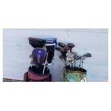 2 sets of golf clubs