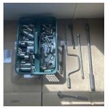 Various Tools. Primarily a green plastic organizer