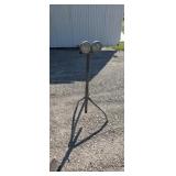 Portable adjustable roller rest stand
