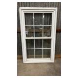 White vinyl single-hung window with grids