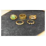 Gold-toned rings with different designs,