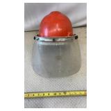 Industrial hard hat with a clear face shield