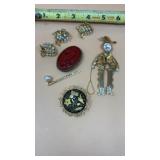 Vtg red carved cameo brooch, a gold-toned figure