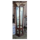 Curio cabinet featuring a hexagonal design