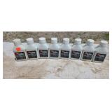 Eight bottles of two cycle oil