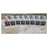 Eight bottles of 2-cycle oil