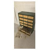 Parts cabinet with mower parts