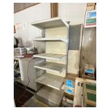 Metal showcase measures 67 inches tall x 18 deep