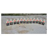 12 bottles of Red Max 2-cycle oil.