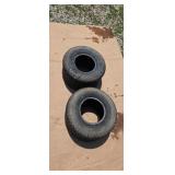 Rear tires off a Bad Boy ridding mower.