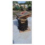 Spool of new chainsaw chain