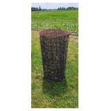 Roll of woven fence wire.