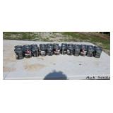 24 cans of Red Max 2-cycle engine oil.