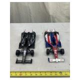 two 1:18 Scale Indy Car Die-cast Models, likely
