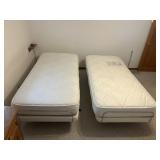 2 Twin Beds that Lift and Massage Comes With
