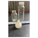 Evenflo glass baby bottles, featuring clear glass