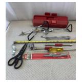 Black-handled scissors, wrenches, various