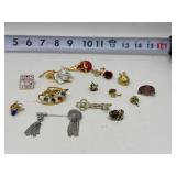 Collection of vintage costume jewelry pins and