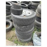2 Stacks of Tires Various Sizes