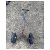 Hand Held Trailer Dolly with Two Flat Tires.