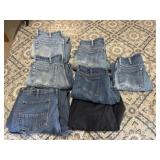 Various Sizes of Mens Jeans and a Pair of Shorts