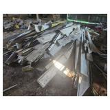 Large pile of aluminum siding