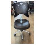 Multipurpose Chair with a black perforated back,