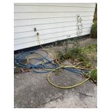 Two Garden Hoses With Two Good Ends