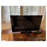 Vizio 42 Inch TV With Remote and a circuit Strip