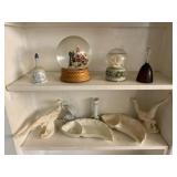 Snow Globes, Bells And All On Shelves