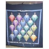 Handmade Quilt Featuring a Repeating Geometric