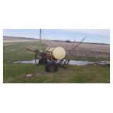 Pull type field sprayer.