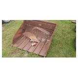 Older loader tractor bucket with horse drawn plow