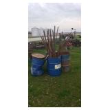 4 steel drums with steel fencepost