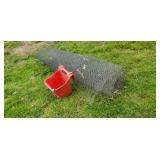 Roll of chicken wire  fence bucket.