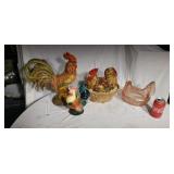 Chickens two him on the nest (pink one is