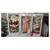 3 large Christmas dolls.