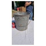 Old galvanized advertising bucket