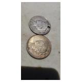 Two peace silver dollars one has hole drilled in