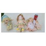 4  Precious  Moments dolls.