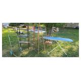 Shelving unit  ironing board   painting easel.