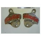 Two cast iron Coke Cola bottle openers