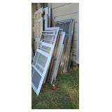 Large stack of storm windows.