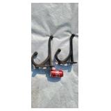 Old cast iron harness hooks.