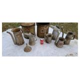 Oil cans advising grease buckets.