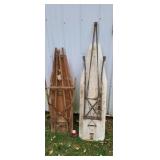 Two old wood ironing boards.