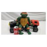 2 big wheels and Ninja turtle doll