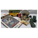 Army guys with toy tanks, pin ball machine and