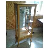 4 ft. curio cabinet on legs with 3 glass shelves