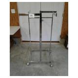 Adjustable height metal rolling clothes rack